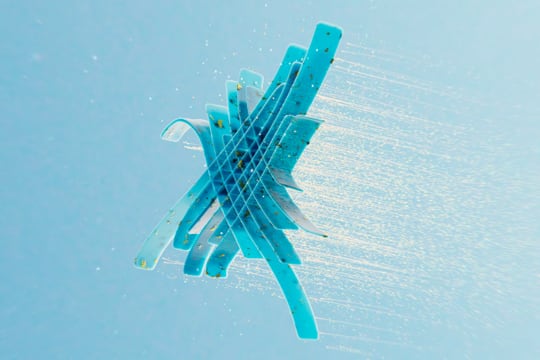 Motion graphics - Artistic snowflake floating on blue background